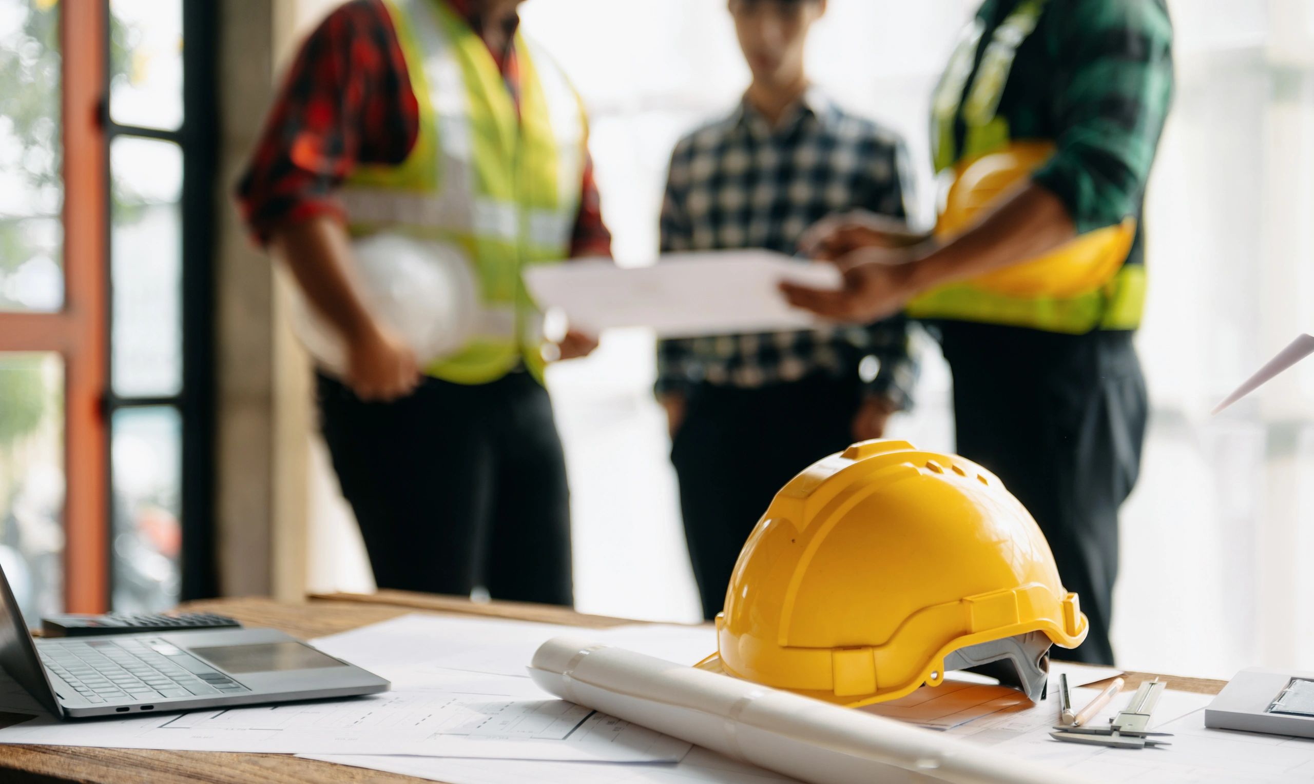 Engineer teams meeting working together wear worker helmets.
